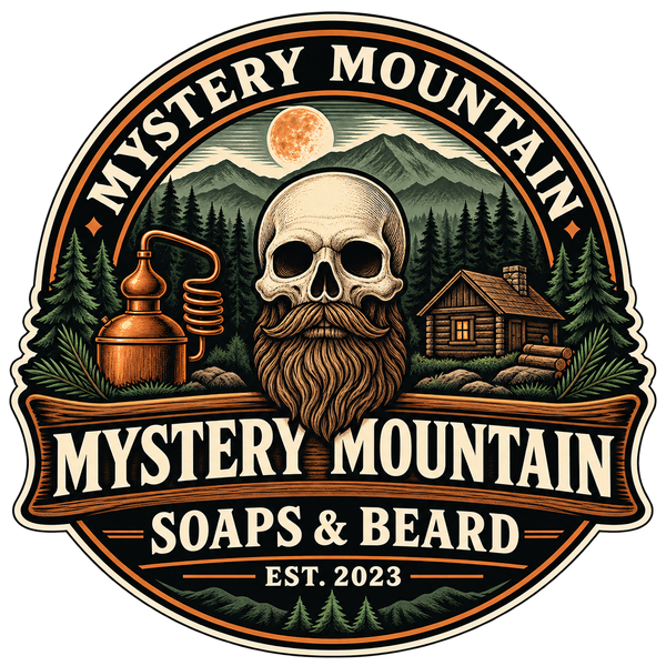 Mystery Mountain Soaps & Beard professional logo with bearded skull, mountains, copper still and cabin